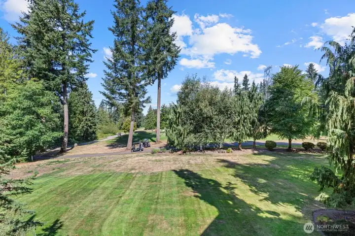 Private sport courts for pickleball and basketball set amid professionally landscaped grounds — offering recreation and relaxation in a park-like setting just steps from home.