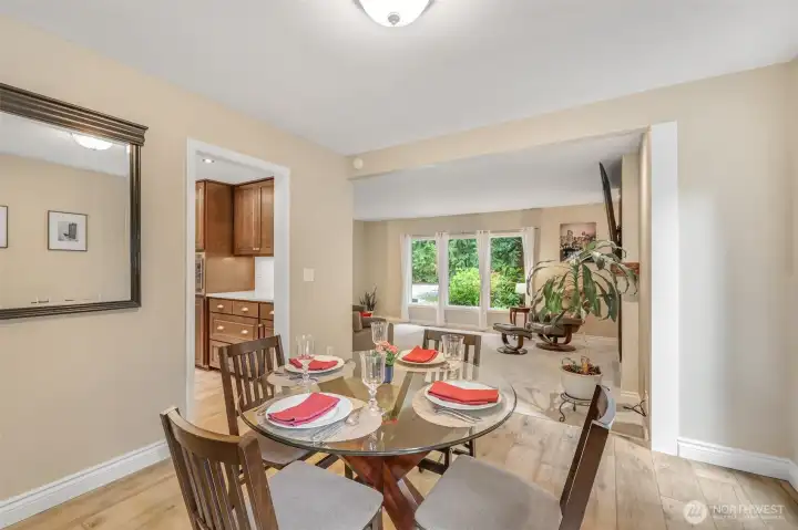 From the dining space, the open flow to the living area is apparent. This thoughtful layout allows for easy movement between spaces, ideal for gatherings and day-to-day living.