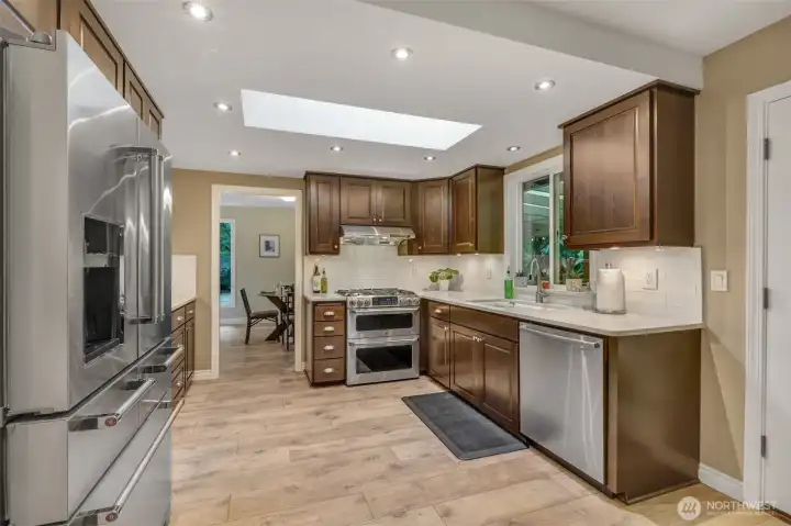 A closer view highlights the thoughtful design of the kitchen. With ample counter space, a double oven, and a gas cooktop, this kitchen is ready to handle both everyday meals and holiday gatherings.