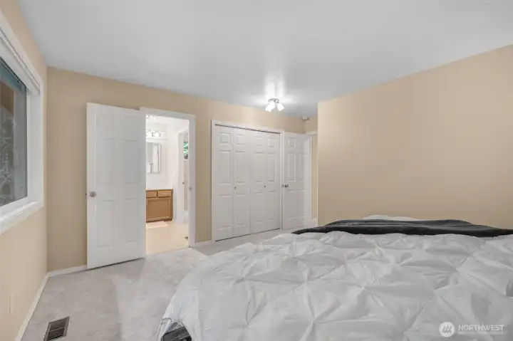 The primary suite includes dual closets and an ensuite three-quarter bath. Practical storage and convenience are thoughtfully built into the design.