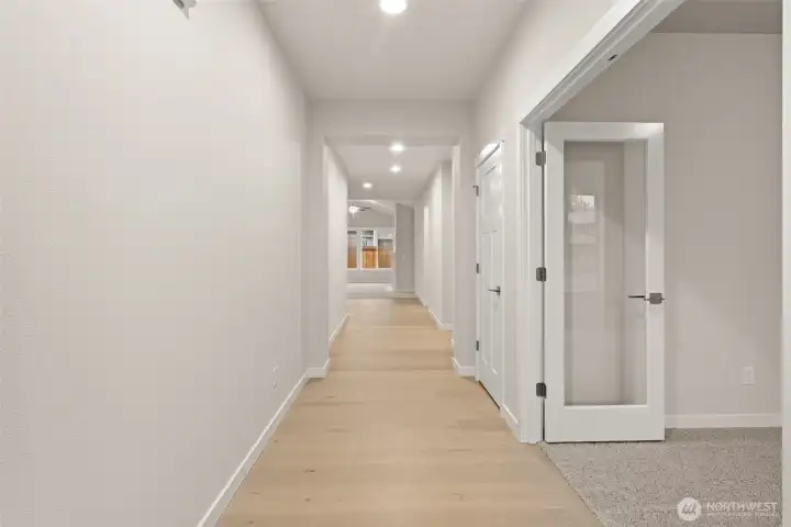 Office/Den or 3rd bedroom is off to the right with clear glass double doors.