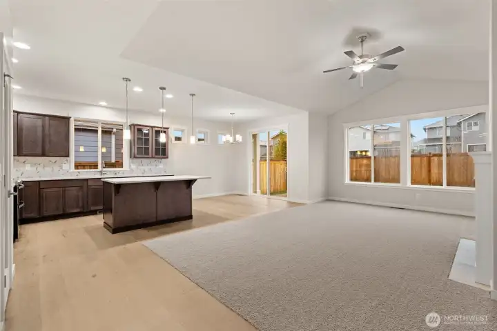 Spacious open concept living area that integrates kitchen & dining for living and entertaining.
