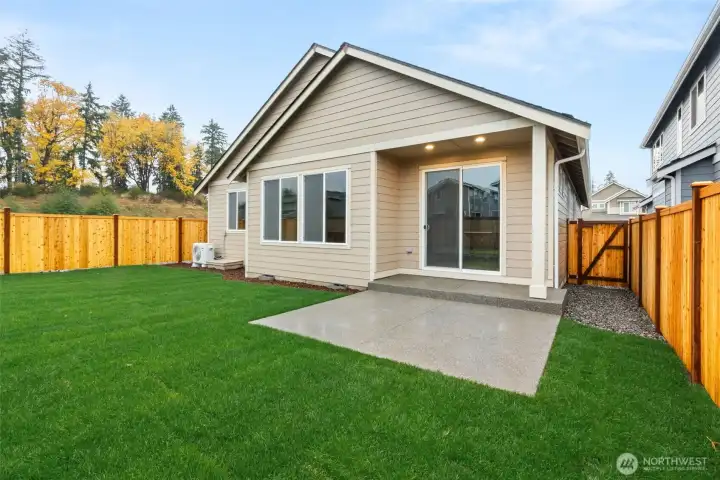Extended patio for additional outdoor living space.