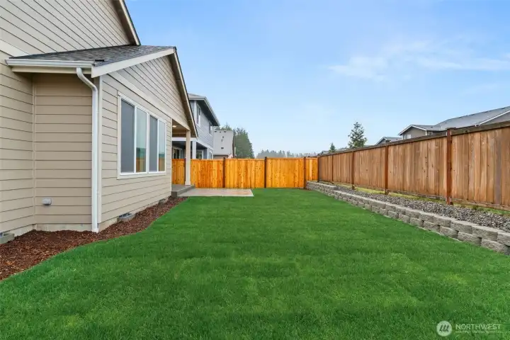 Backyard is fully landscaped.