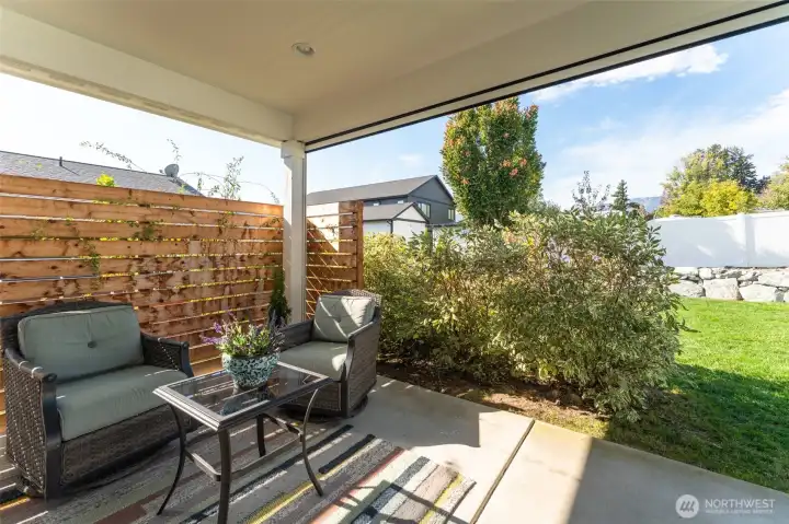 Patio with privacy screen, plantings & wall