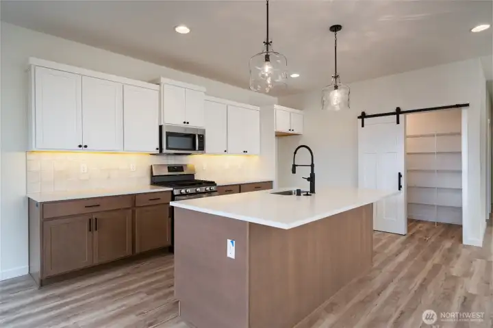 Kitchen - Pics are of a different 3049 plan. Features and colors may differ.