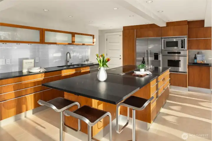 Honed single-slab granite countertops and stainless-steel appliances