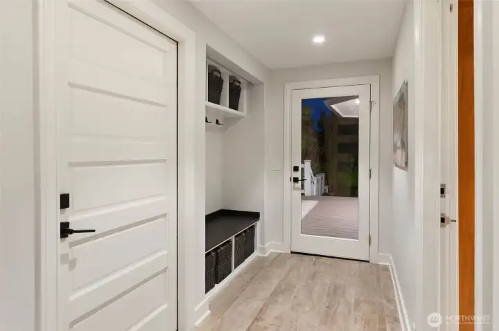 Mudroom off the garage with access to the backyard.