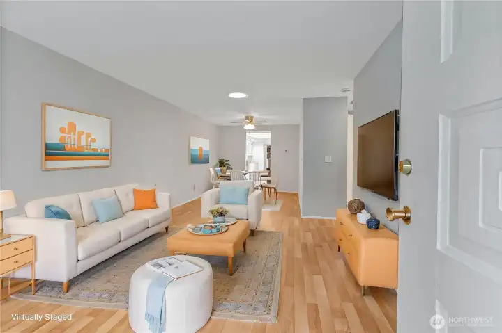 Beautifully updated living room with laminate floors. (virtually staged)