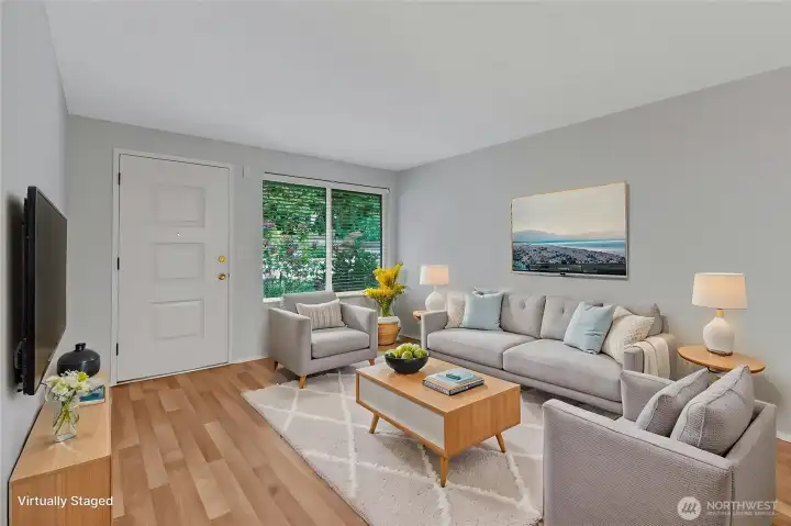 Another view of your living room facing the front doorway. (virtually staged)