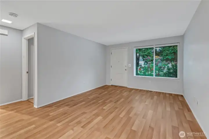 From the living room, you can see the entrance to the bedroom areas to the left.