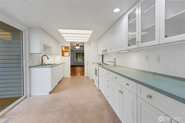 So much storage and counter space in this bright and airy kitchen!