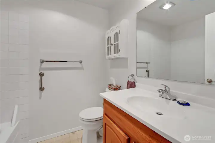 Bathroom located conveniently between both bedrooms.