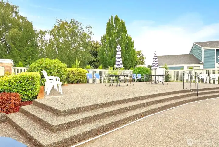 Spacious lounging deck area near the pool.