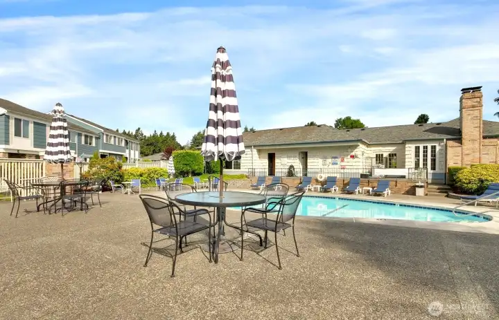 Bring your refreshments to enjoy near the pool, complete with table seating areas.