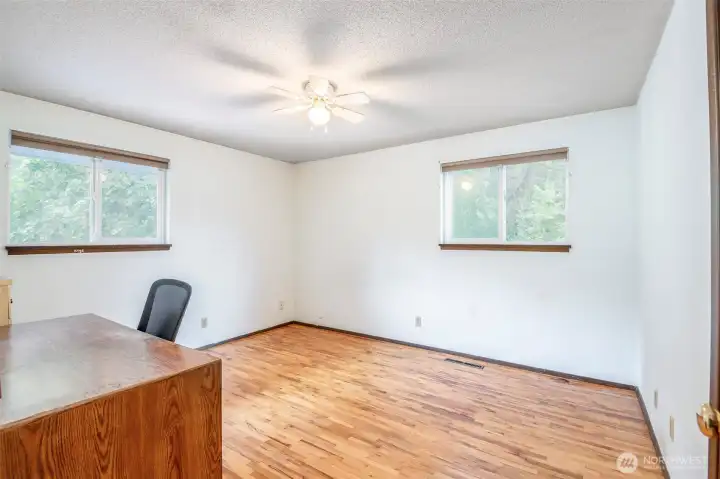 Bed 1 upstairs, hardwood flooring.