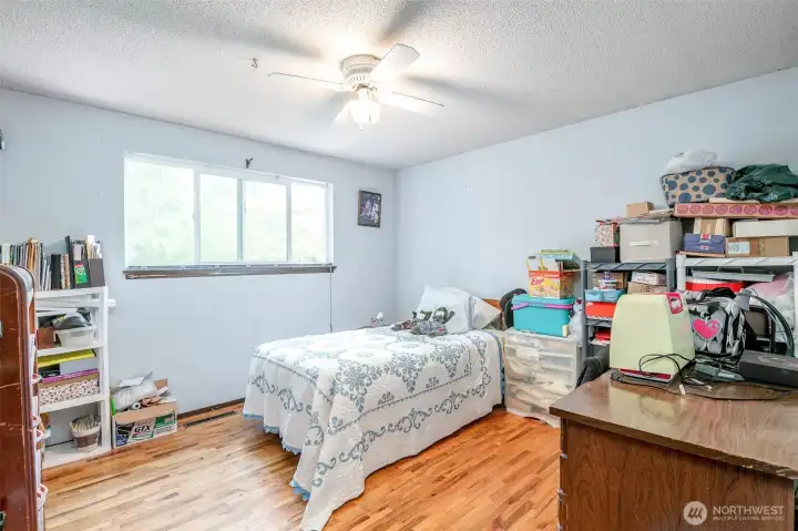 Bed 2, upstairs, hardwood flooring.