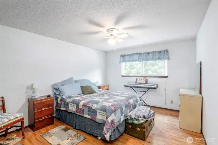 Bed 3, upstairs, hardwood flooring.