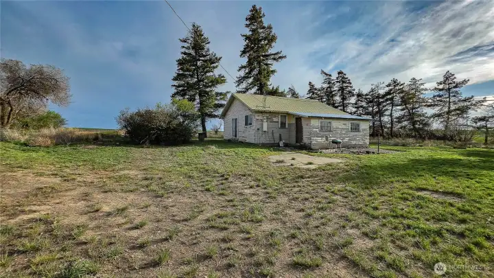 Looking SW from the NE area: Bring your vision! Though the home may need a bit of love and work, this property is the perfect canvas to create your new dream ho