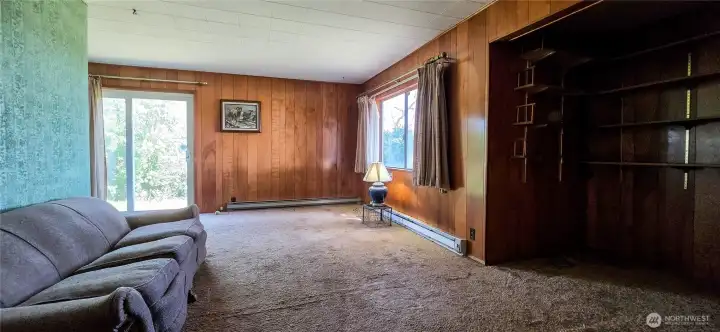 Looking East across livingroom. Notice the versatile bump-out addition tucked to the right, offering a dedicated space that is perfectly sized for a small home office or reading nook."