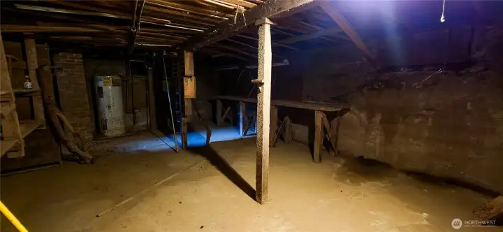 Conveniently accessed directly from the kitchen, the unfinished basement provides excellent, wide-open access to the home's wiring and plumbing, making future additions, updates, or a full remodel incredibly convenient.