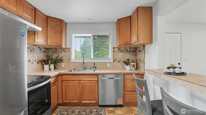 The eat-in kitchen features new appliances.