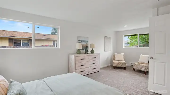 A large primary bedroom offers room for a flexible design.