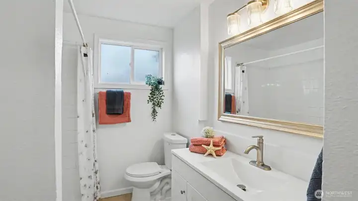 A full bathroom upstairs includes a new vanity and toilet.
