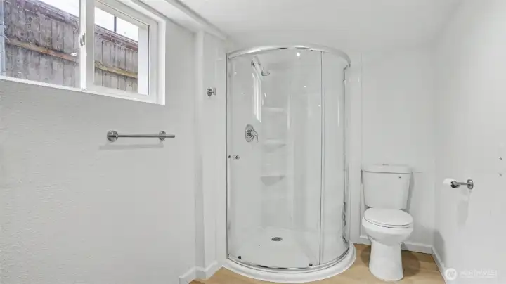 The second bathroom located in the finished basement offers a stand-up shower.