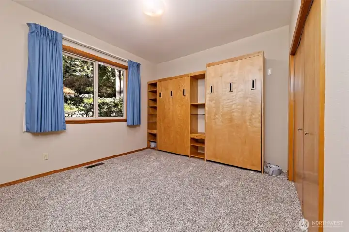 Main floor bedroom with two Murphy beds built in that stay. Main floor bedroom with two Murphy beds built in that stay.