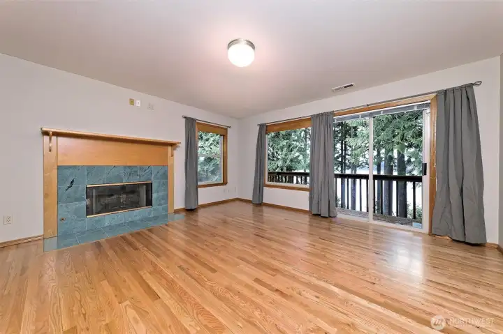 The second Primary bedroom upstairs, also with its own bathroom, and a gas fireplace and a slider to a small deck. The second Primary bedroom upstairs, also with its own bathroom, and a gas fireplace and a slider to a small deck.