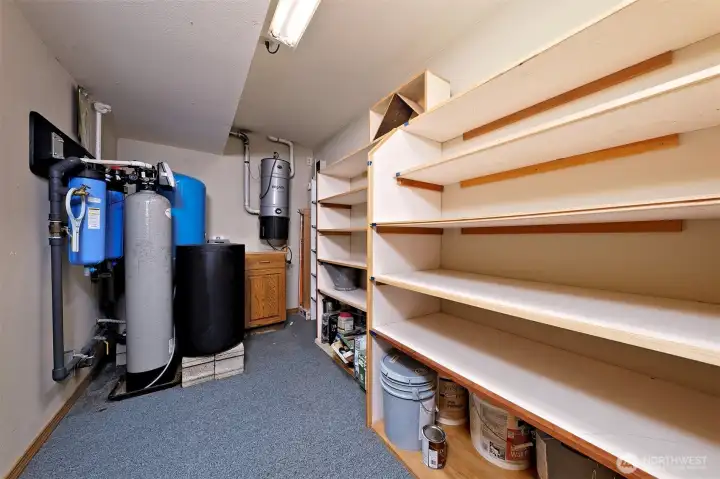 Mechanical room downstairs with the water filter/softener and the built-in whole-house vacuum Mechanical room downstairs with the water filter/softener and the built-in whole-house vacuum