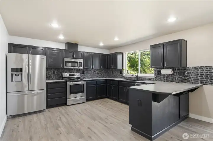 Spacious kitchen with plenty of cabinets and counterspace