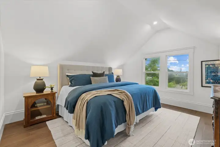 Primary Bedroom with vaulted ceilings.