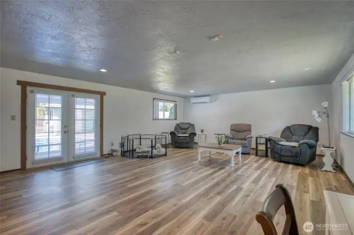 Large livingroom area with french doors to covered patio.