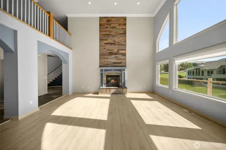 Living Room with Brand New LVP Propane Fireplace and Powered Blinds