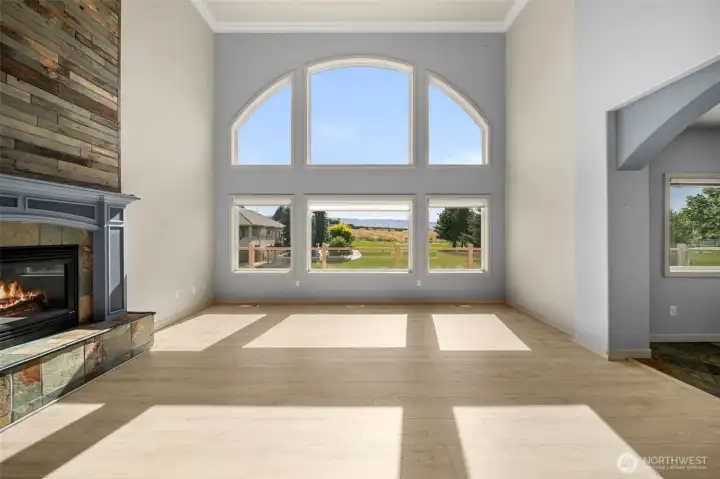 Living Room with Soaring Ceilings to the Second Floor Open to Kitchen and Breakfast Nook
