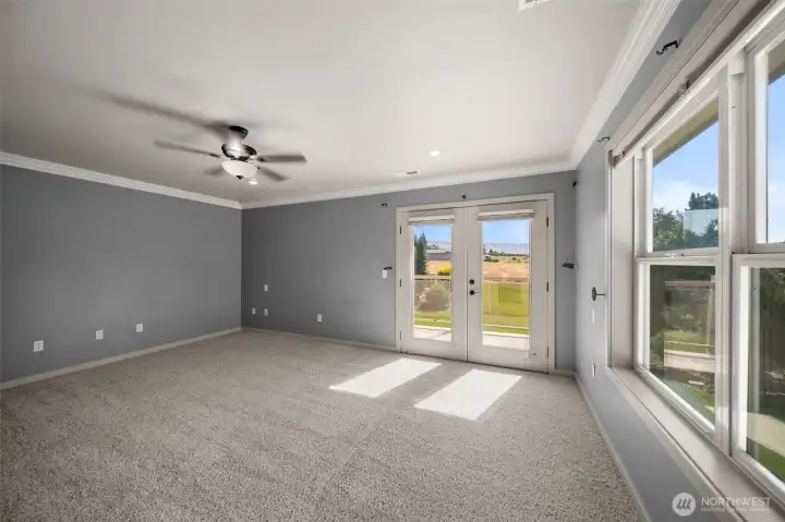 Large Primary with French Doors Leading to Private Balcony