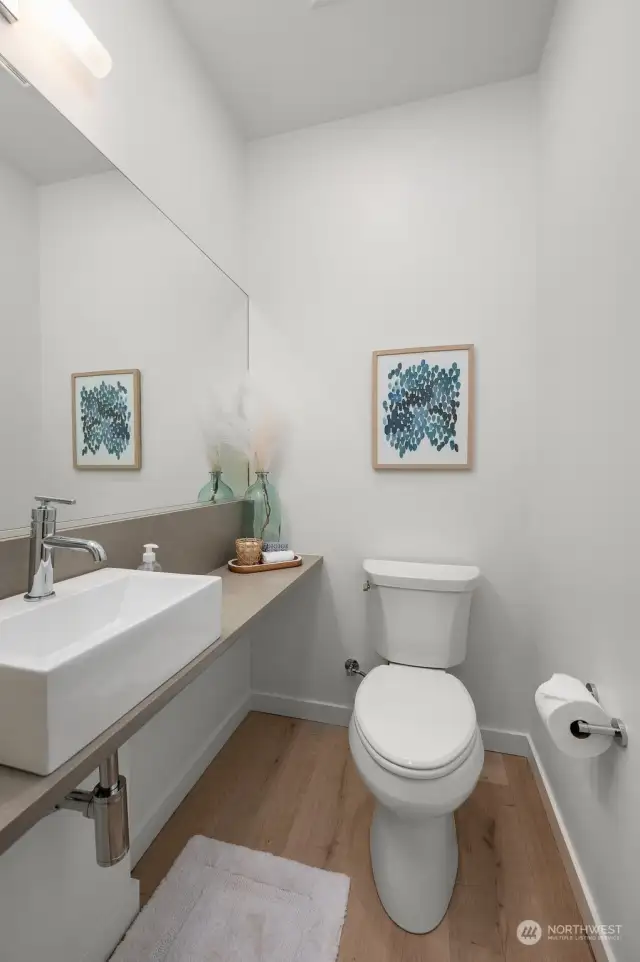 A chic powder room with modern finishes, perfect for guests.