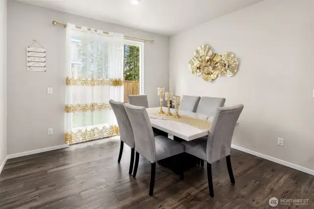 The dining area with slider doors leading out to the back patio