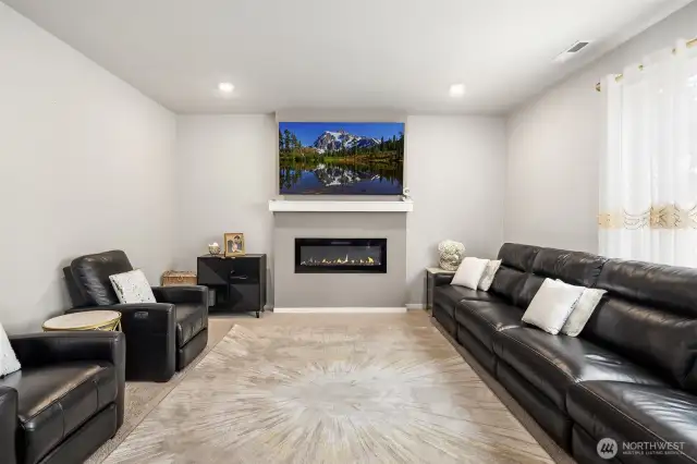 The Living Room has lots of space for the larger families and gatherings. A cozy fireplace too!