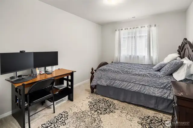 The main level 5th bedroom. Has closet to the left side. This does make a good Home Office / Den.  Also ideal for a guest room.