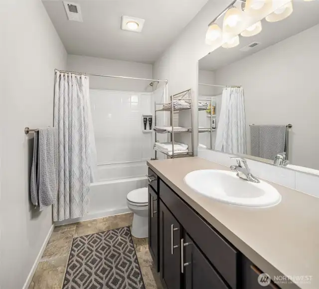 Hall bathroom upstairs has shower over the tub