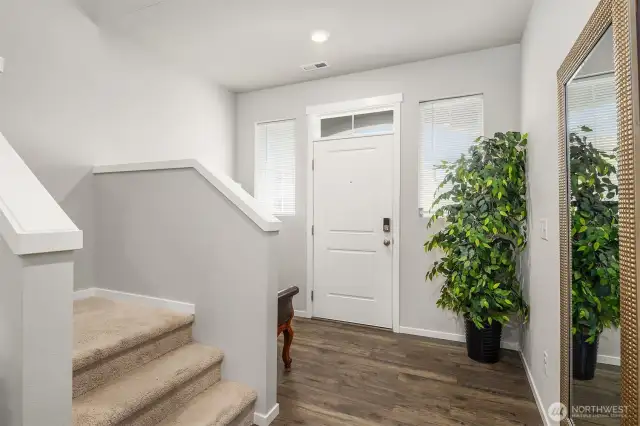 A larger front entry way has plenty of room for a bench seat or entry table