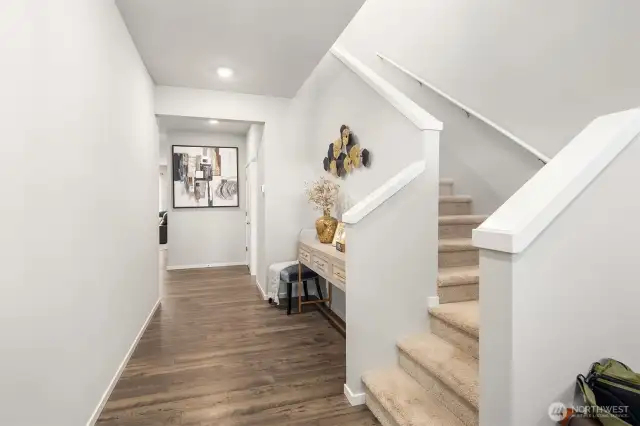 As you come into the house there is nice wood floors, and space to use as you desire.  Notice the good natural light coming into the house from the front windows and upper hallway.