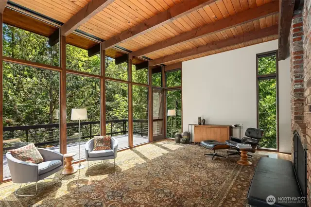 "Beams stretch across the living room and travel outside, reaching for the woods" - Pacific NW Magazine    Motorized blinds
