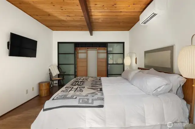 Primary bedroom with custom closet system