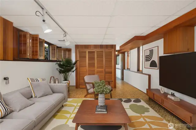 Lower level rec room. Virtually staged.