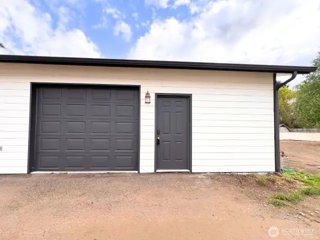 Garage Space 1- Full Size Garage Door and Standard Door.
