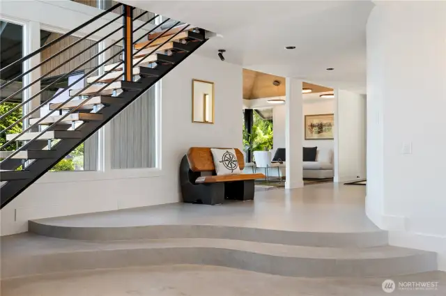 This is a portion of the expansive entry shown. Both the stairs and the bench have a story. The stair treads were made from trees on the property.